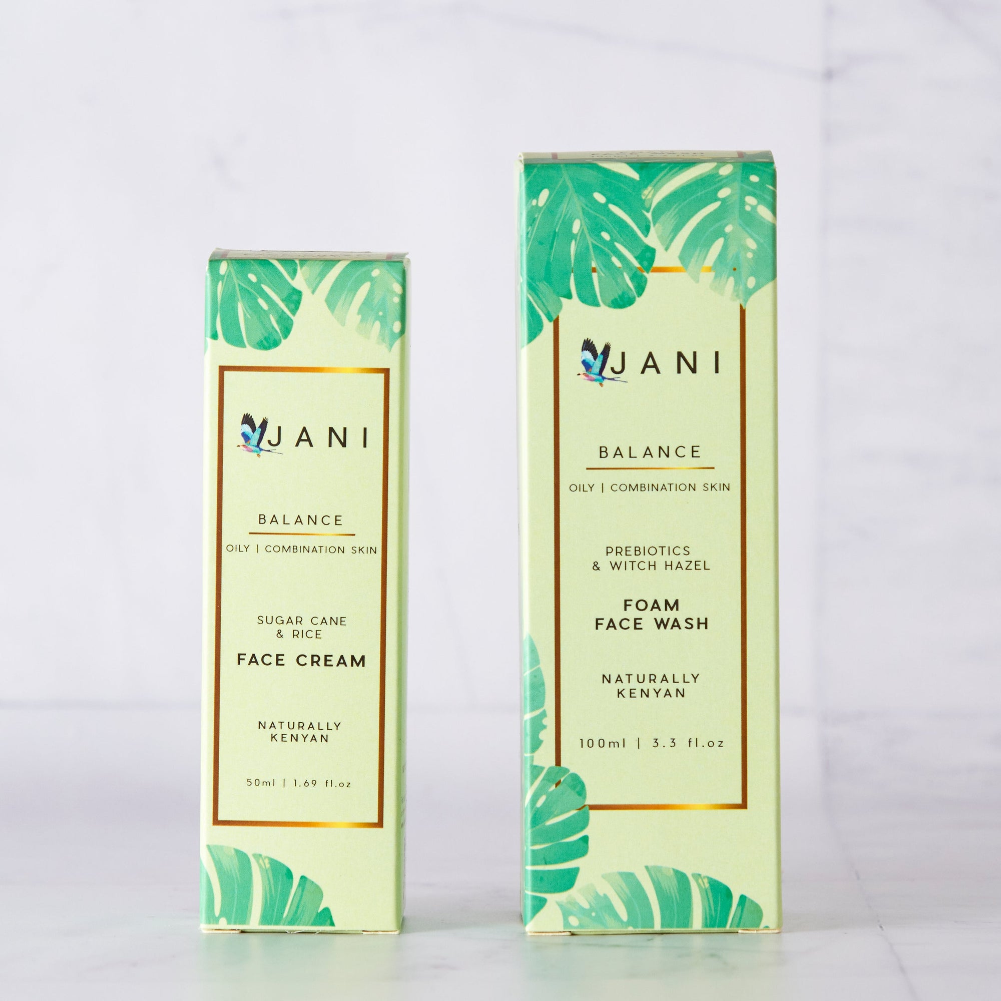 Two skincare product boxes with leaf designs on a white background