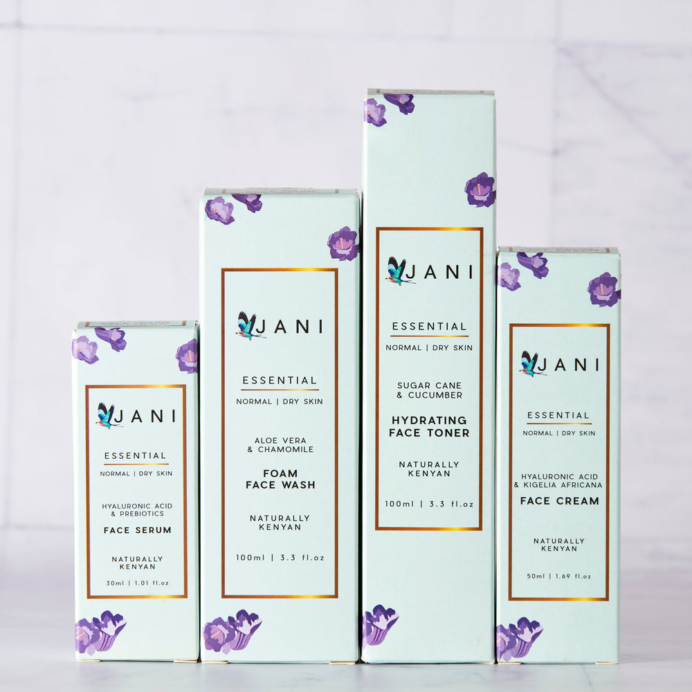 Set of JANI skincare products on a light gray background