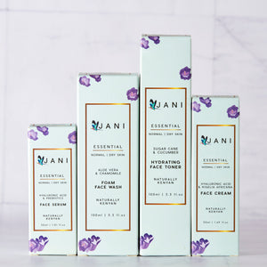 Set of JANI skincare products on a light gray background