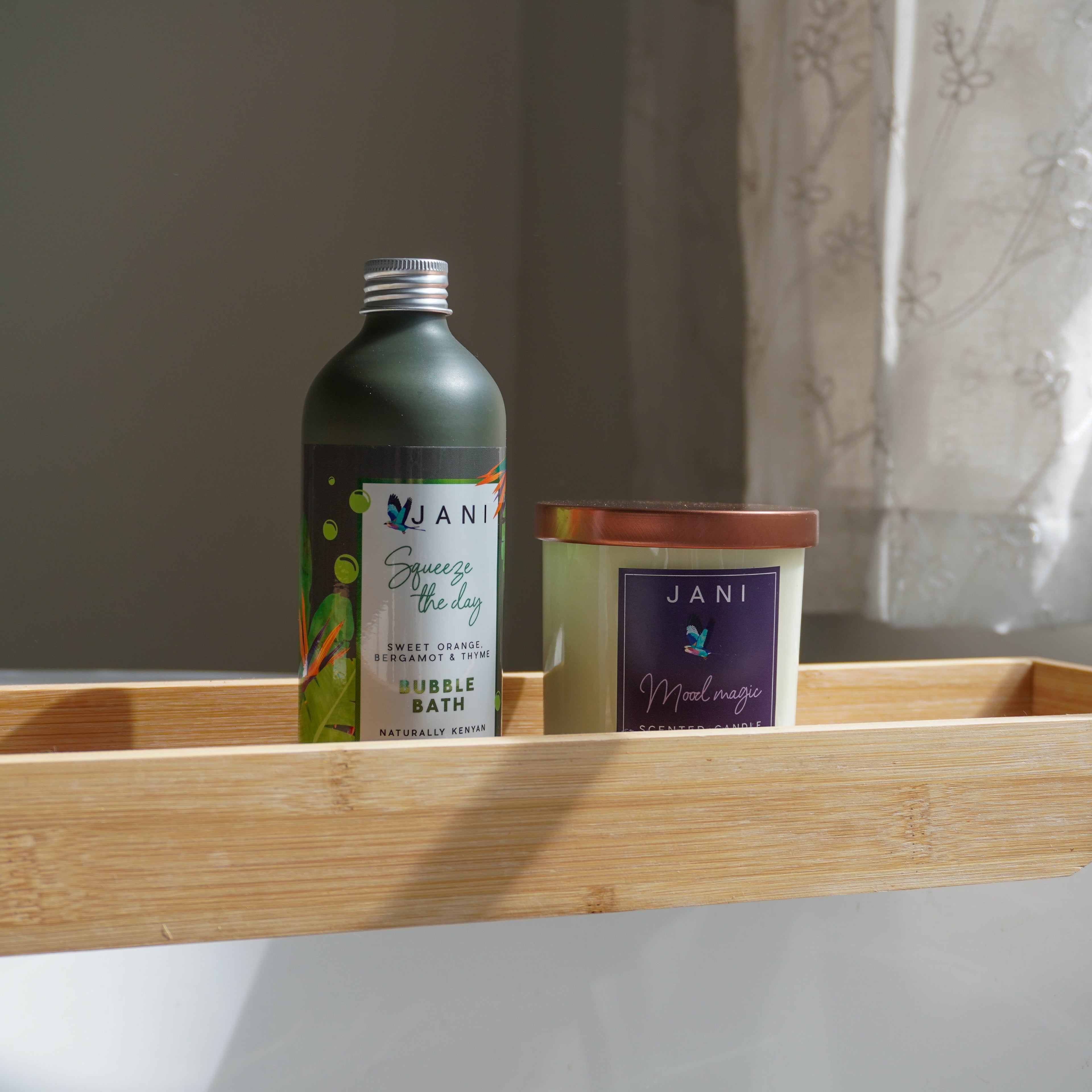 Bathroom shelf with JANI products including a bottle and a jar.