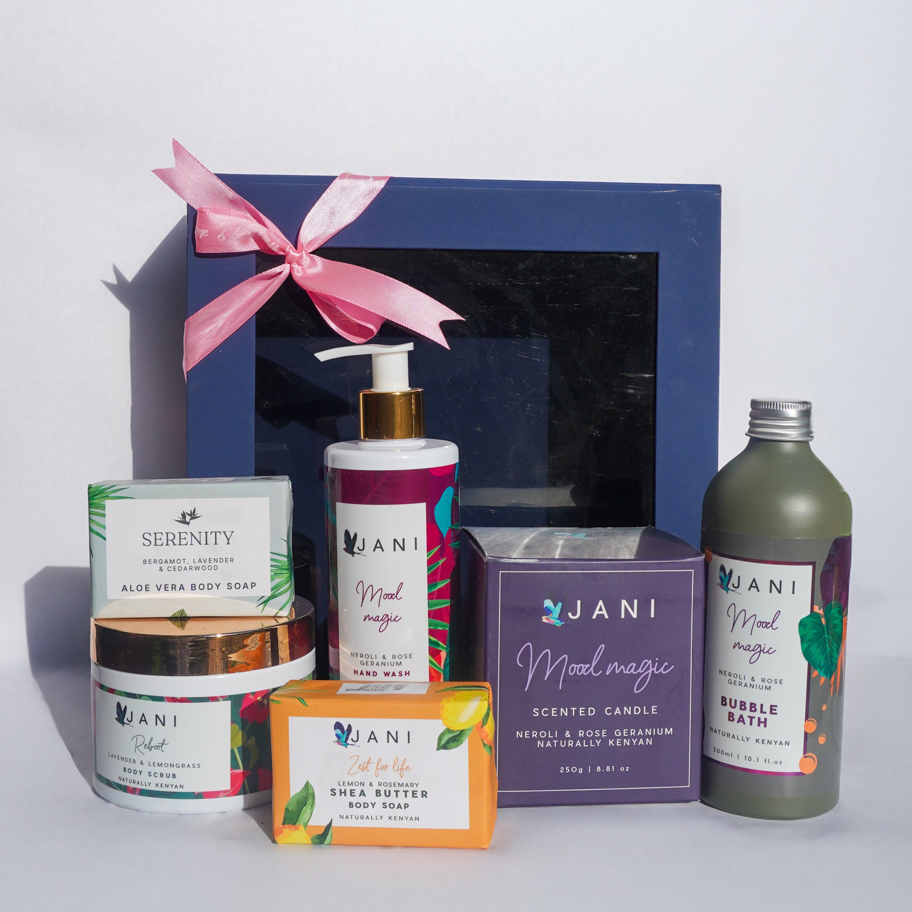 Collection of Jani products including candles, soap, and bath bombs on a white background