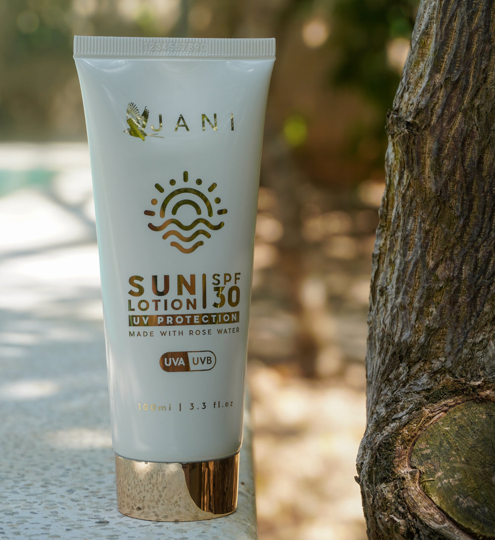 Sun lotion tube with 'JANI' branding on a white background