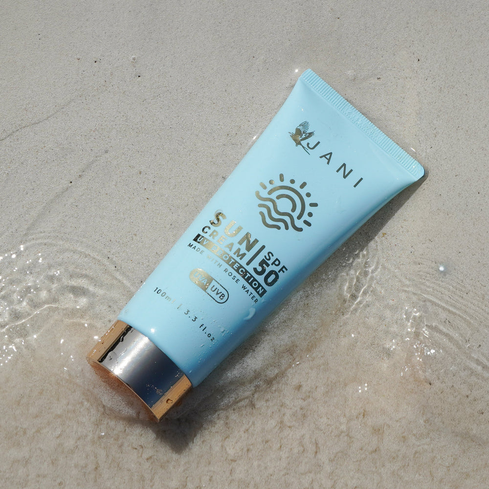 Sunscreen cream tube with 'JANI' branding on a white background