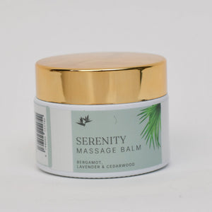 Serenity massage balm jar with gold lid on a light gray background