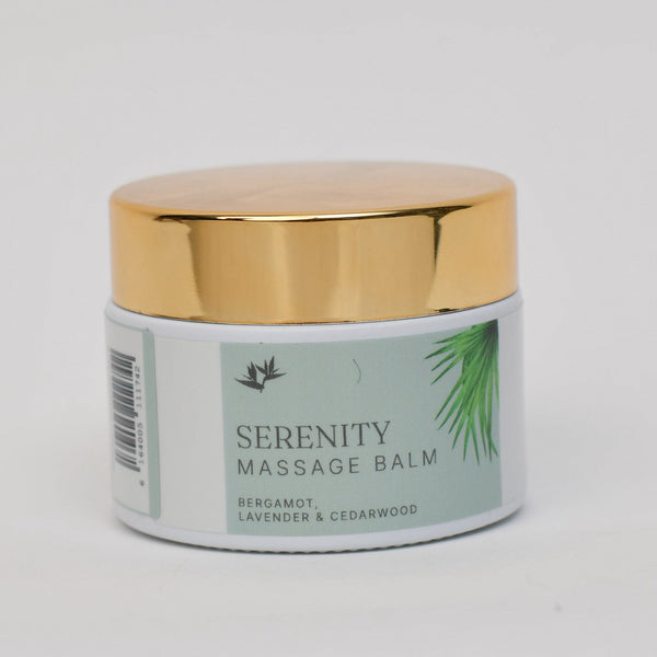 Serenity massage balm jar with gold lid on a light gray background